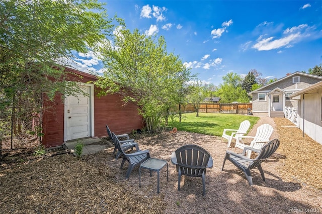 7340 W 32nd Ave, Wheat Ridge, CO 80033 - fenced backyard featuring entry steps and an outbuilding