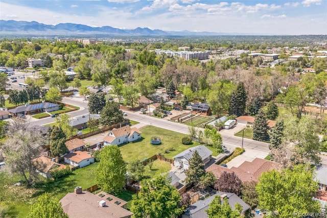 7340 W 32nd Ave, Wheat Ridge, CO 80033 - aerial perspective of suburban area featuring a mountain backdrop