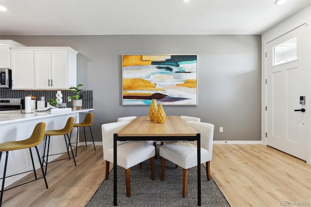 22203 E 6th Pl, Aurora, CO 80018 - dining area featuring light wood-style flooring, recessed lighting, and baseboards