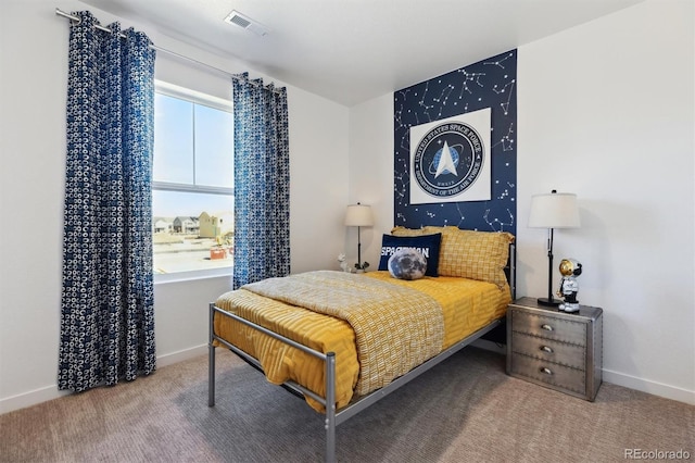 22203 E 6th Pl, Aurora, CO 80018 - carpeted bedroom featuring multiple windows and baseboards