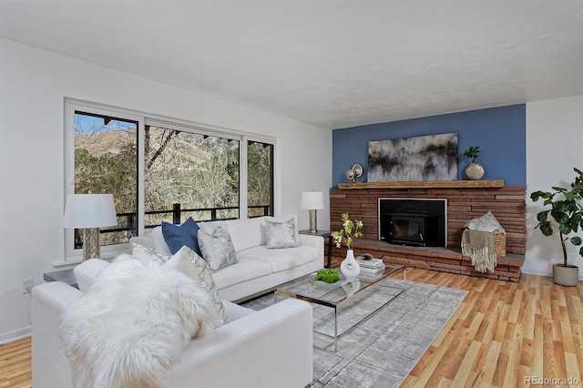 living room with baseboards and wood finished floors