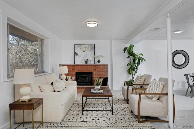 living room featuring baseboards, visible vents, and carpet floors