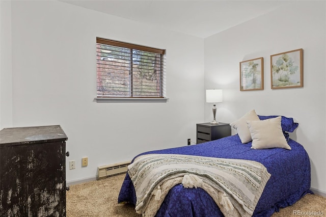 bedroom with carpet floors, baseboards, and a baseboard radiator