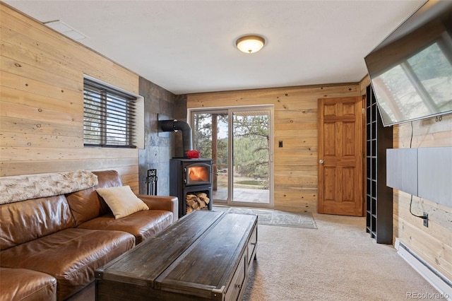 31214 Evans View Ln, Pine, CO 80470 - carpeted living area featuring wood walls and a wood stove