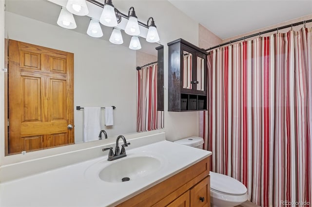 31214 Evans View Ln, Pine, CO 80470 - full bath featuring toilet, vanity, and a shower with curtain