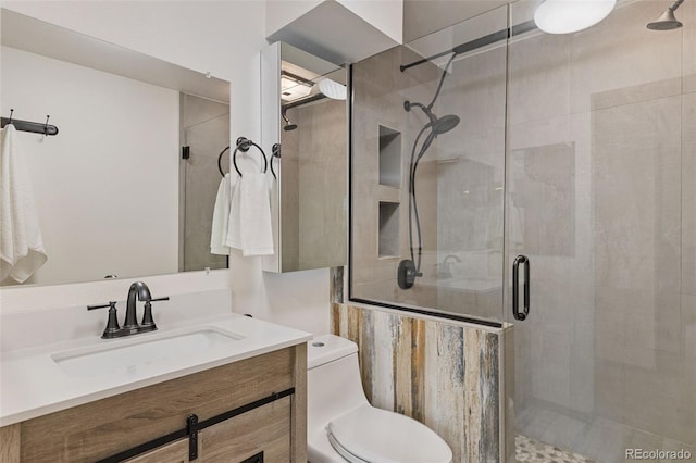 31214 Evans View Ln, Pine, CO 80470 - bathroom with a stall shower, vanity, and toilet