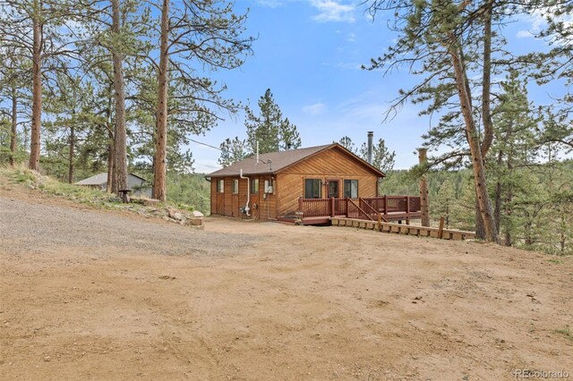 31214 Evans View Ln, Pine, CO 80470 - rear view of property featuring a deck and dirt driveway