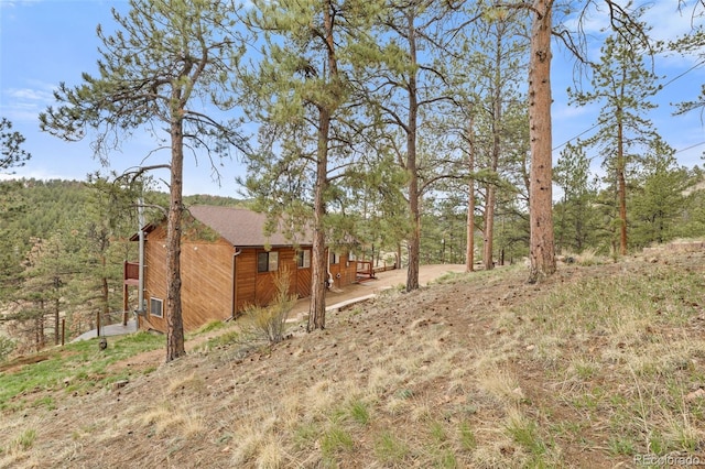 view of yard featuring a view of trees