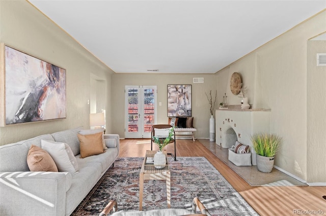 living room featuring hardwood / wood-style floors and french doors