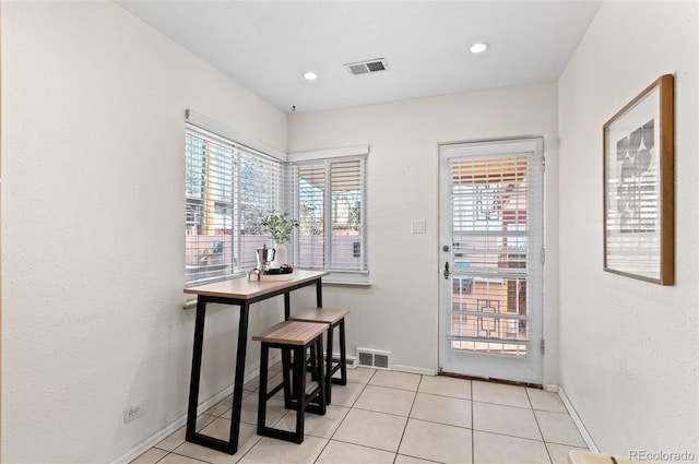 doorway featuring light tile patterned flooring