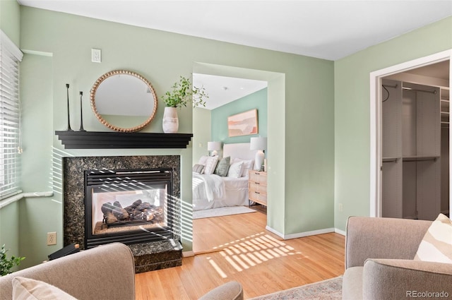 interior space with hardwood / wood-style flooring and a high end fireplace