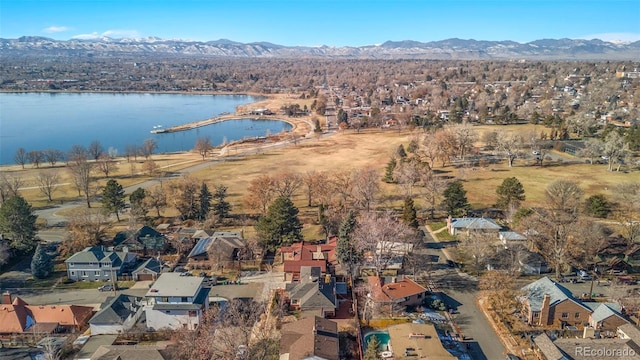 drone / aerial view with a water and mountain view