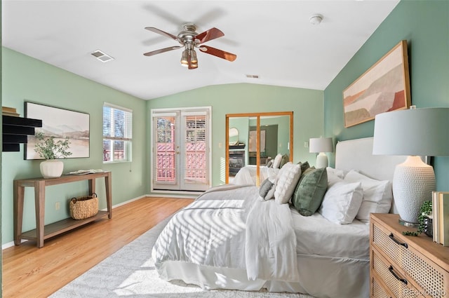 bedroom featuring vaulted ceiling, ceiling fan, and light hardwood / wood-style floors