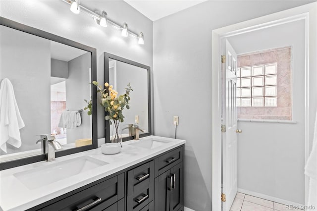 bathroom featuring tile patterned flooring and vanity