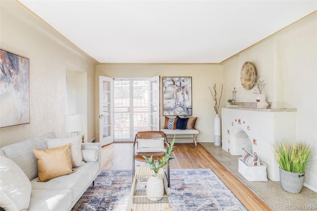 living area featuring french doors and wood finished floors