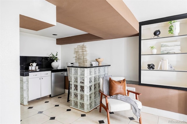 bar with stainless steel dishwasher and light tile patterned flooring