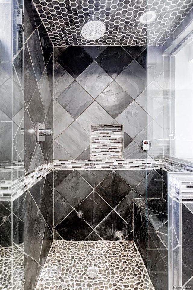 interior space with a tile shower