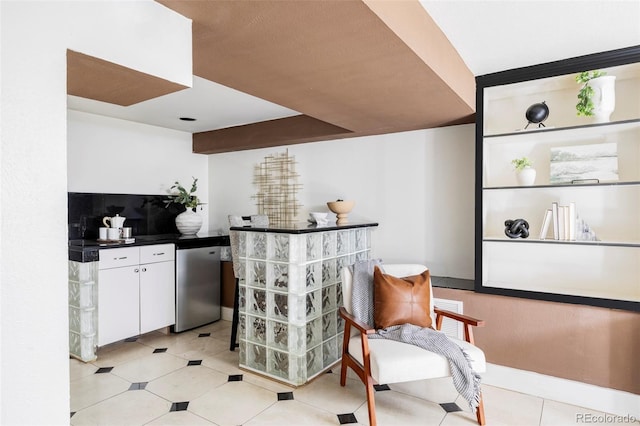 bar area with dishwasher and light tile patterned floors