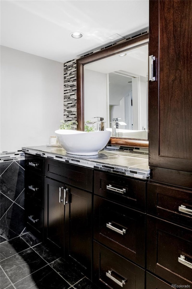 bathroom featuring vanity and recessed lighting