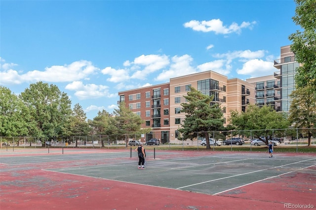view of tennis court with fence