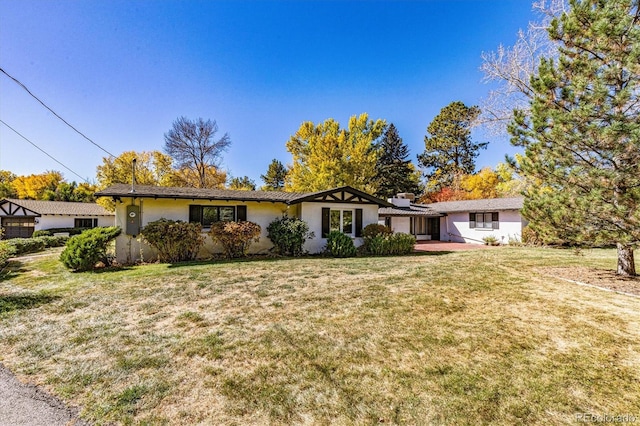 view of front of property with a front lawn