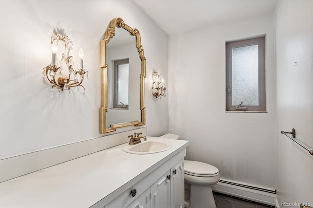 bathroom featuring vanity, a baseboard heating unit, toilet, and tile patterned floors