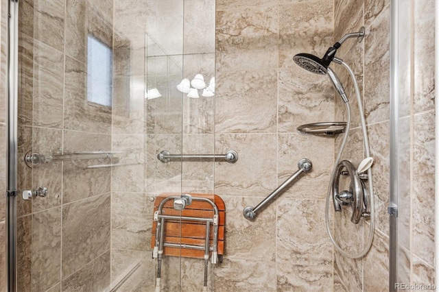 bathroom with a tile shower