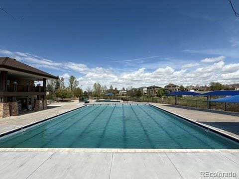 24285 E Wagon Trail Ave, Aurora, CO 80016 - community pool with a patio area