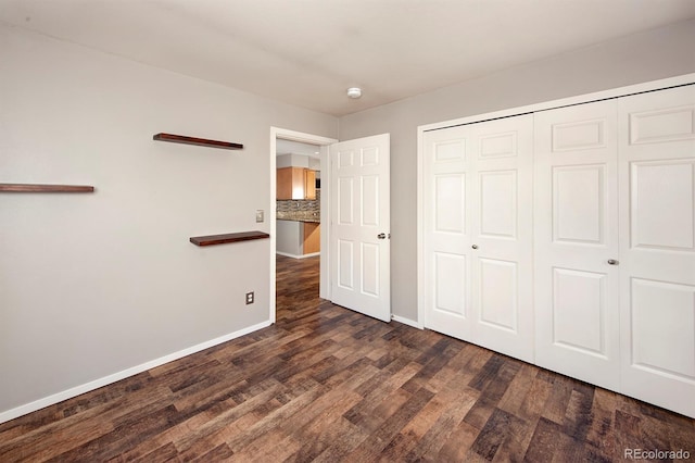 980 Lakepoint Dr Unit 1, Frisco, CO 80443 - unfurnished bedroom featuring dark wood-style floors and a closet