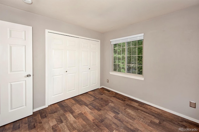 980 Lakepoint Dr Unit 1, Frisco, CO 80443 - unfurnished bedroom with dark wood-style floors and a closet