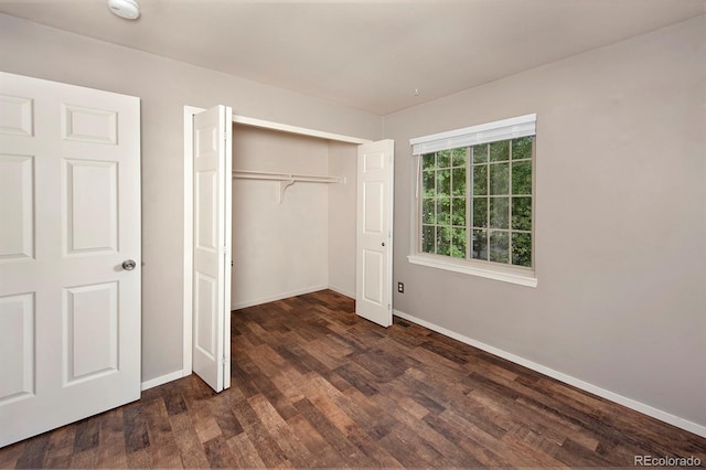 980 Lakepoint Dr Unit 1, Frisco, CO 80443 - unfurnished bedroom with dark wood-type flooring and a closet