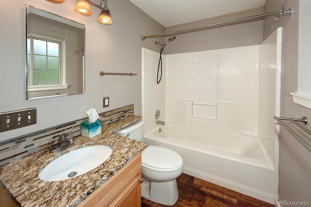 980 Lakepoint Dr Unit 1, Frisco, CO 80443 - bathroom featuring shower / bathtub combination, vanity, wood finished floors, and tasteful backsplash