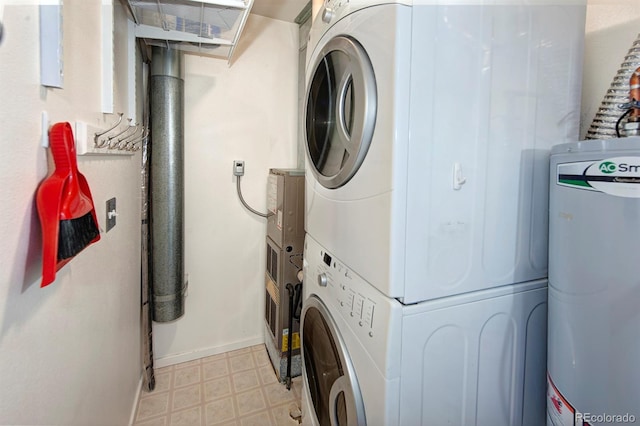 980 Lakepoint Dr Unit 1, Frisco, CO 80443 - washroom with water heater, estacked washer and dryer, and light floors