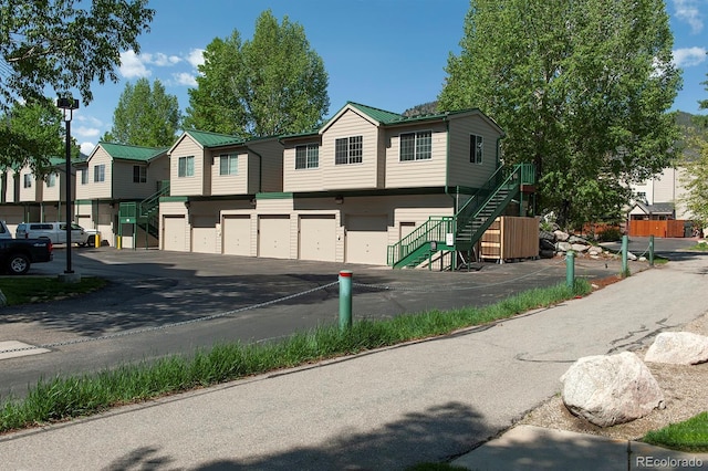 980 Lakepoint Dr Unit 1, Frisco, CO 80443 - view of asphalt road featuring stairway and a residential view
