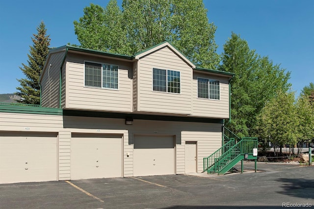 980 Lakepoint Dr Unit 1, Frisco, CO 80443 - view of front of home featuring stairway and a garage