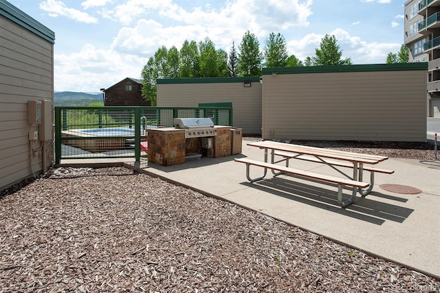980 Lakepoint Dr Unit 1, Frisco, CO 80443 - view of patio featuring an outdoor kitchen and a gate