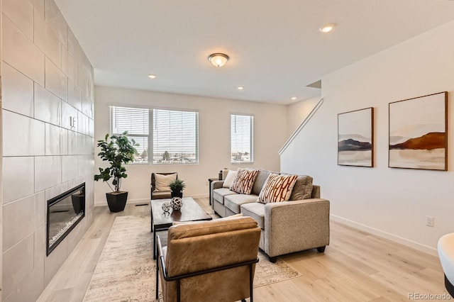 374 N Geneva, Aurora, CO 80010 - living area featuring a fireplace, light wood-style floors, baseboards, and recessed lighting