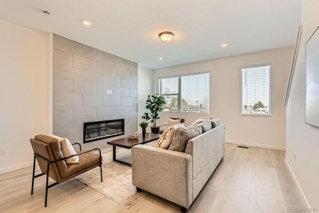 374 N Geneva, Aurora, CO 80010 - living room with baseboards, light wood finished floors, a tile fireplace, and recessed lighting