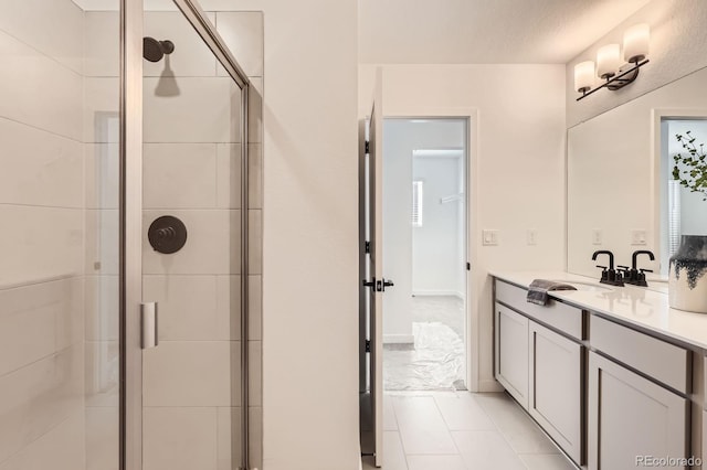 374 N Geneva, Aurora, CO 80010 - full bathroom with a stall shower, vanity, and marble look tiles