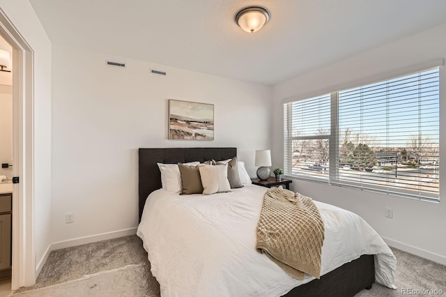 374 N Geneva, Aurora, CO 80010 - bedroom with carpet flooring, baseboards, and ensuite bath