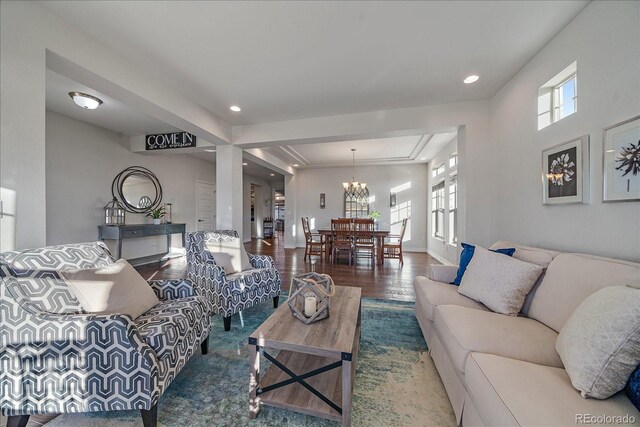 315 Painted Horse Way, Erie, CO 80516 - living room featuring wood finished floors, a chandelier, recessed lighting, and baseboards