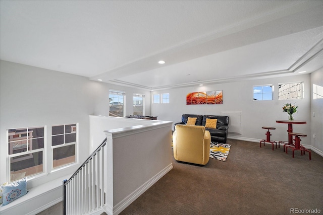 315 Painted Horse Way, Erie, CO 80516 - living room featuring a tray ceiling, baseboards, recessed lighting, and carpet floors