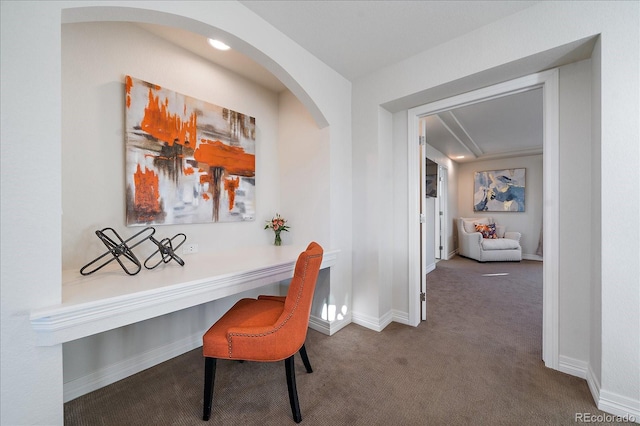 315 Painted Horse Way, Erie, CO 80516 - office area featuring carpet, baseboards, arched walkways, and built in study area