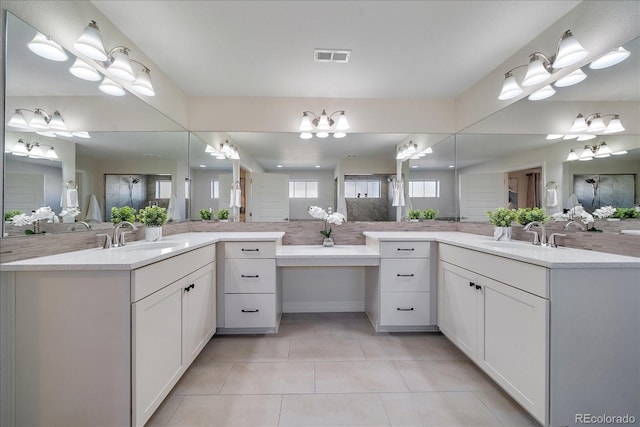 315 Painted Horse Way, Erie, CO 80516 - bathroom with two vanities, tile patterned floors, a shower stall, and a chandelier