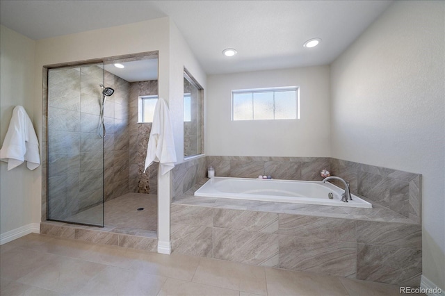 315 Painted Horse Way, Erie, CO 80516 - full bath featuring a garden tub, a walk in shower, tile patterned floors, and recessed lighting