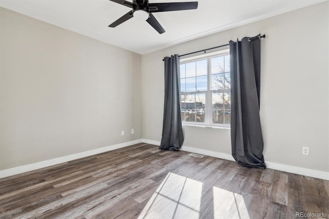 unfurnished room with hardwood / wood-style flooring and ceiling fan