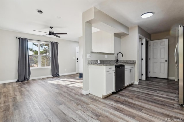 kitchen featuring white cabinets, wood-type flooring, black dishwasher, and ceiling fan