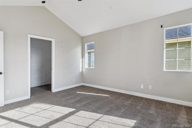 unfurnished bedroom with carpet flooring, lofted ceiling, and a closet