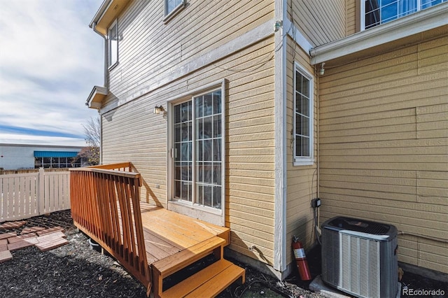 wooden terrace featuring central AC unit