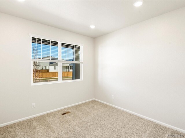 view of carpeted spare room